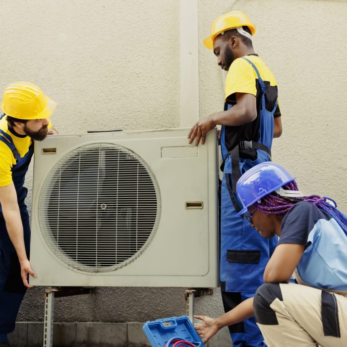 Team replacing old air conditioner AC Repair Services